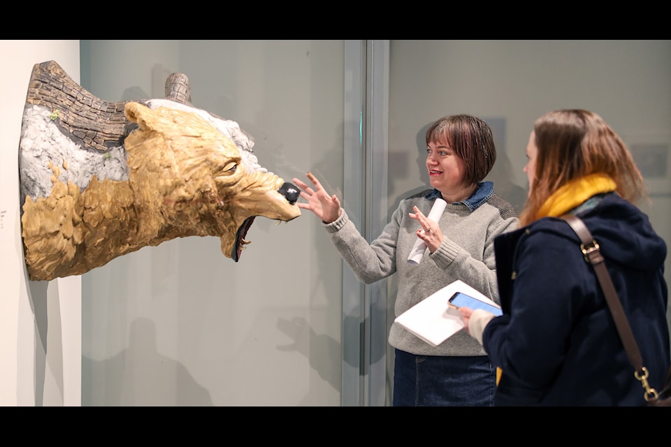 Yukon Arts Centre's director of visual arts Mary Bradshaw speaks to a reporter at the Anchorage Museum. (Hank Davis photo, courtesy of Anchorage Museum)