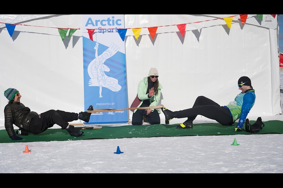 Competitors try to pull each other over in an Arctic Sports event at the Whitehorse Nordic Festival held at the Whitehorse Spring Nordic Centre on March 8. (Jim Elliot/Yukon News)