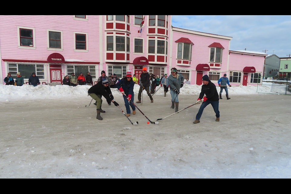 There was a lively street hockey game in front of the Westminster Hotel  during the Thaw Di Gras Spring Carnival in Dawson City. (Dan Davidson Photo)