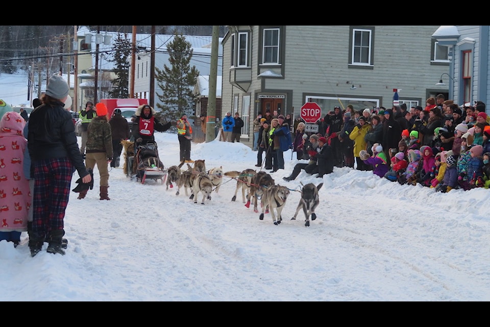 Luc Tweddell and his dog team run past spectators the Percy DeWolfe Memorial Mail Race. (Dan Davidson Photo)