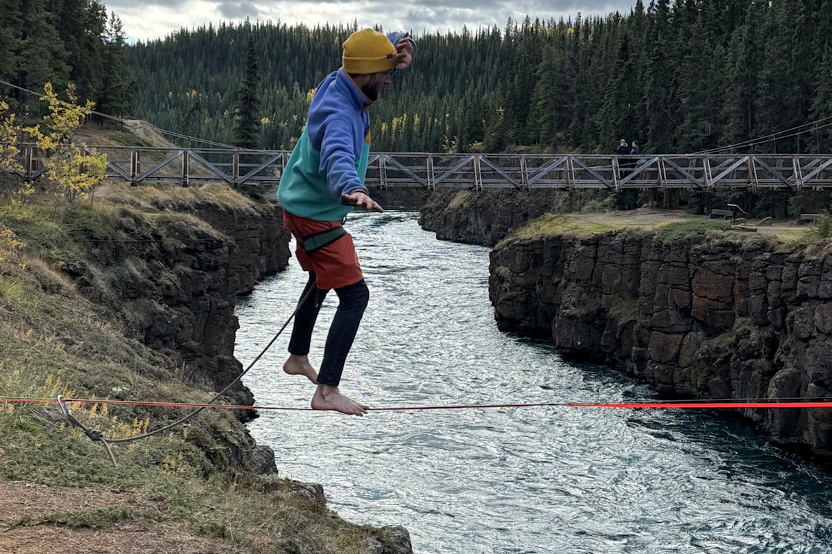 Men attempt crossing of Whitehorse's Miles Canyon on a slack line