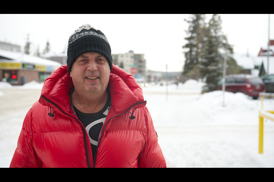 Richard Chippett poses for a photo outside the Yukon News office on Feb. 20 after sitting down to reflect on his Rendezvous flour packing record. (Jim Elliot/Yukon News)