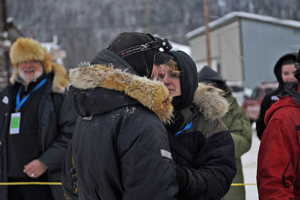 Richie Beattie and his wife Emily Rosenblatt embrace after Beattie was reunited with his team at the Dawson checkpoint on Feb. 7 during the 2020 Yukon Quest (John Hopkins-Hill/Yukon News)