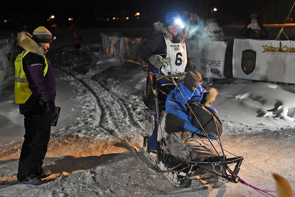 Swedish rookie Nora Sjalin was all smiles after finishing the 2020 Yukon Quest on Feb. 13 in Whitehorse. Sjalin crossed the finish line at 7:59 p.m. with 10 dogs on the line in seventh position. As the top finishing rookie in this year’s field, Sjalin won the Rookie of the Year Award. (John Hopkins-Hill/Yukon News)