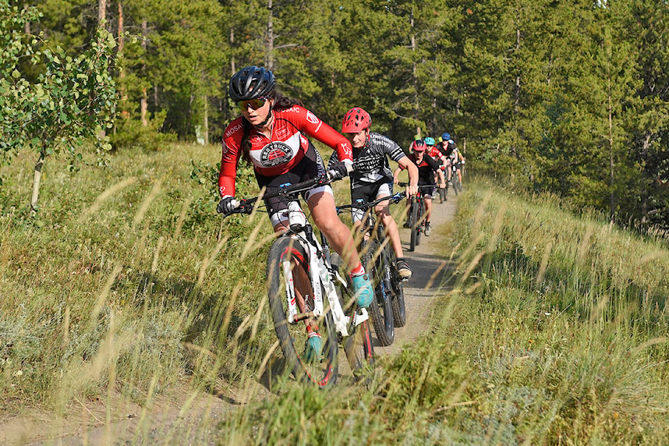 Ava Irving-Staley leads a group of riders with Cole Germain close behind at the start of the first stage of the Yukon Cross-Country Mountain Bike Championships on July 16 in Porter Creek. (John Hopkins-Hill/Yukon News)