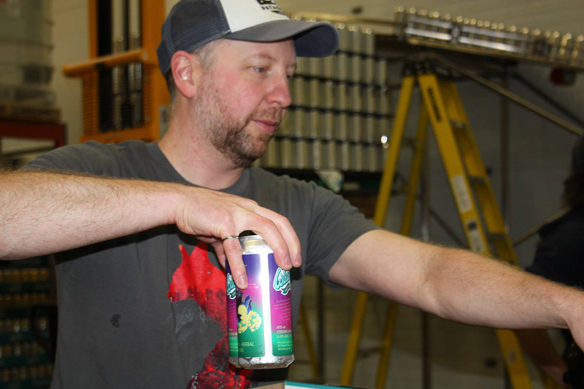 Stephanie Waddell/Yukon NewsMarko Marjanovic readies cans of Witch Craft for International Womens Day at the Winterlong Brewery in Whitehorse on March 8.