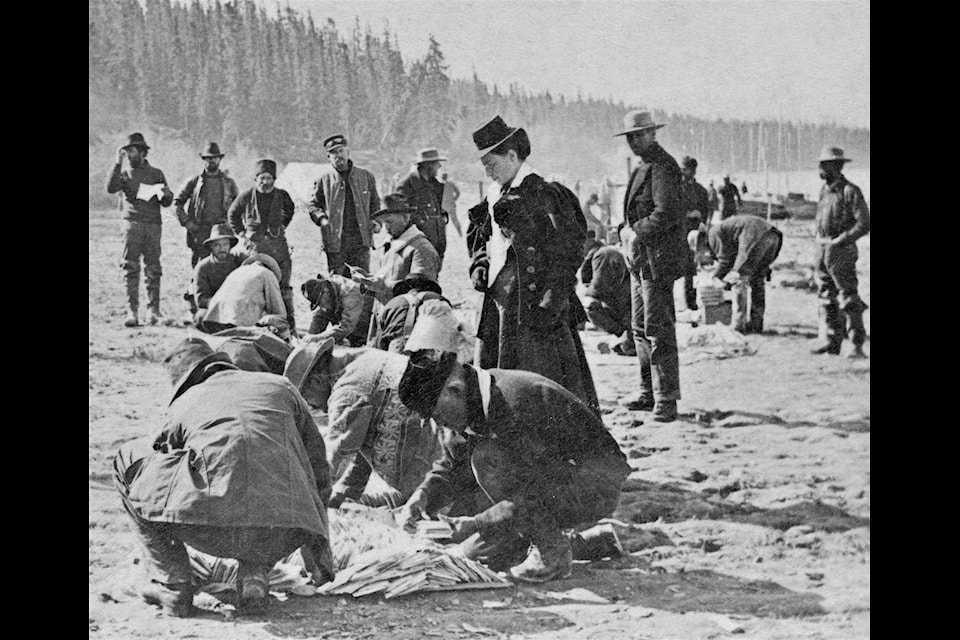 At Tagish in 1898, the Mounted Police laid the mail out on the beach for stampeders to search for letters from home. (Courtesy/Gates collection)