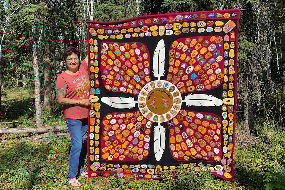 26058174_web1_20210806_YKN_NND_woman_creates_blanket_350-wb_1