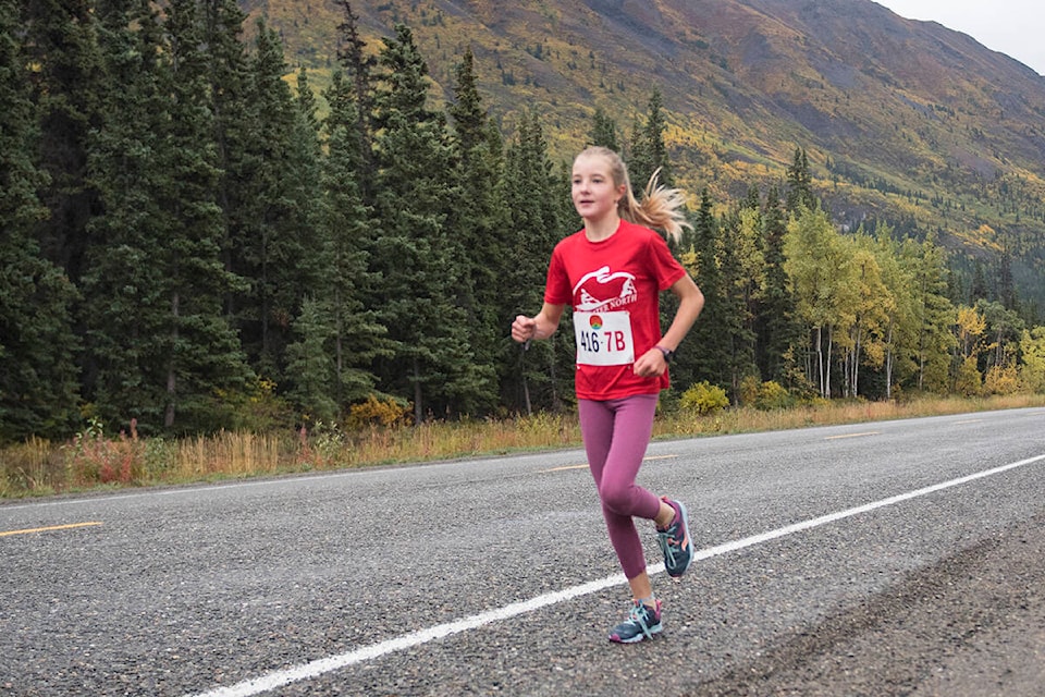 Esther Aasman runs down the South Klondike Highway during the ‘Kinda’ Klondike Road Relayon Sept. 11. (John Tonin/Yukon News)