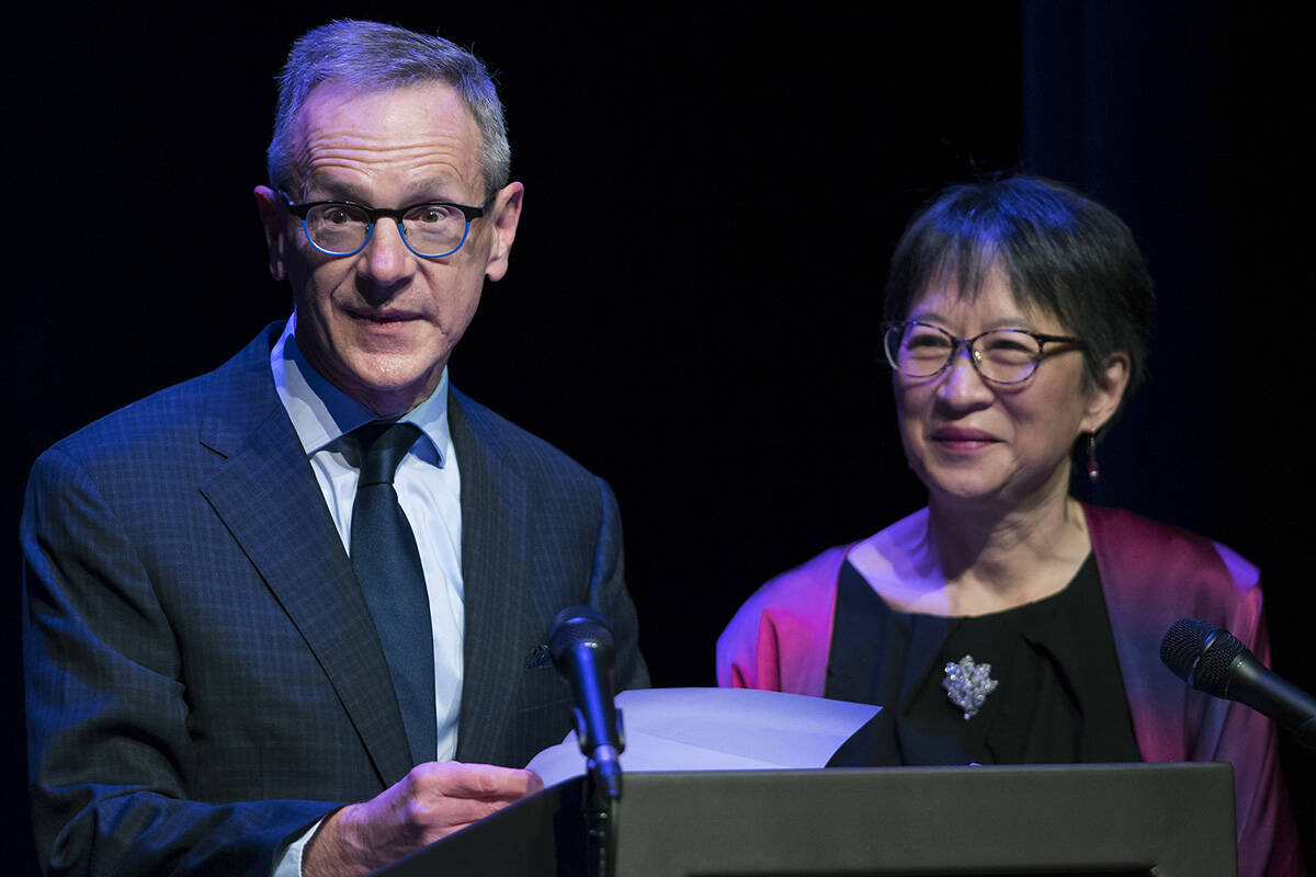 Yukon Prize for the Visuals Arts co-founders David Trick and Julie Jai announce Joseph Tisiga as the winner during the gala show at the Yukon Arts Centre on Nov. 20. (Mike Thomas/Yukon Arts Centre)
