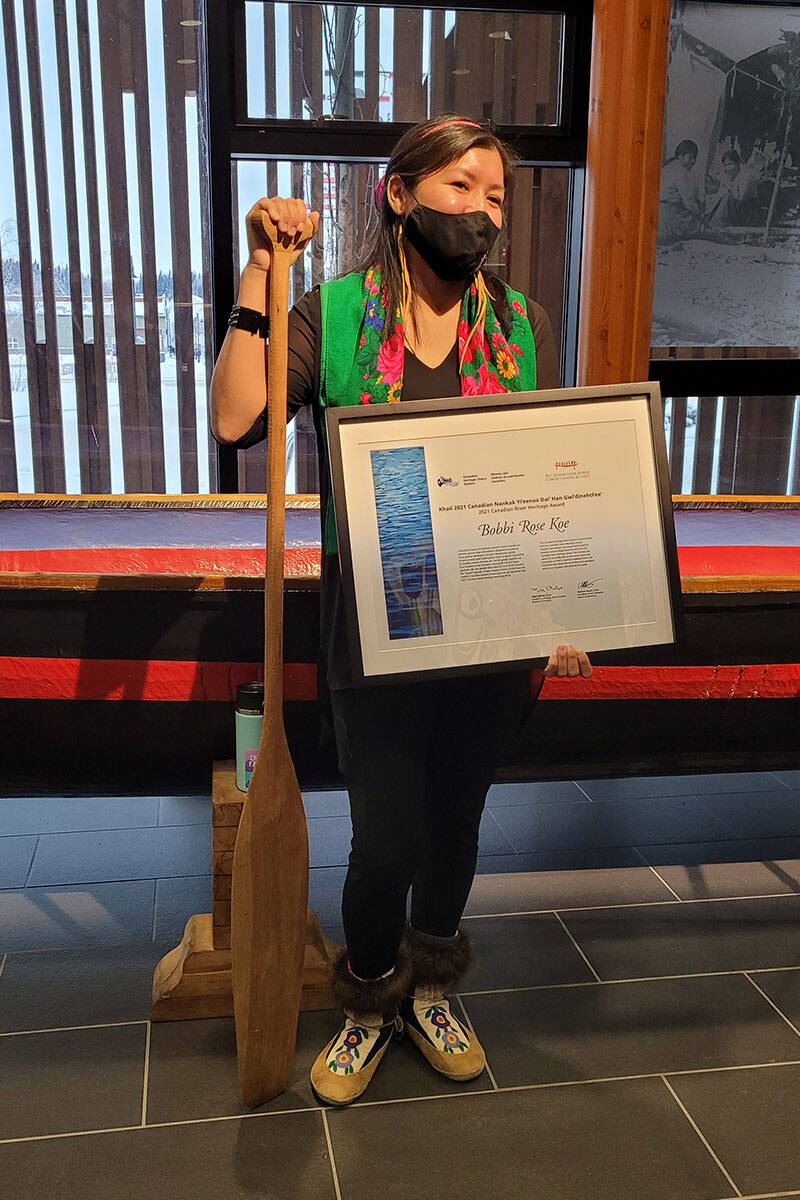 Bobbi Rose Koe accepts the 2021 Canadian River Heritage Award in Whitehorse on Dec. 6. (Chris Rider/Submitted)