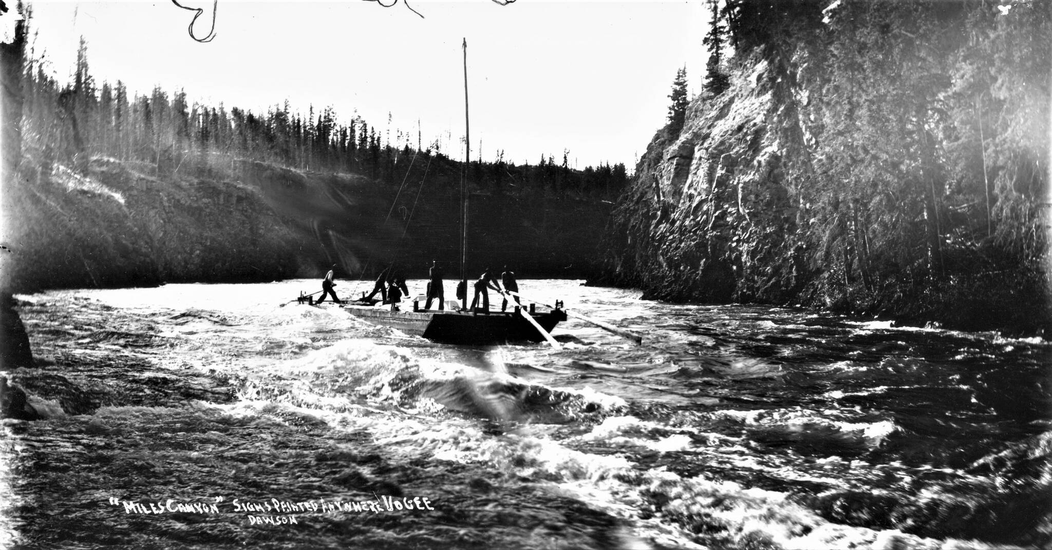 Anton Vogee took the opportunity to promote his work through his photographs. The caption for this image reads: Miles Canyon. Signs Painted Anywhere. Vogee. (Courtesy/Yukon Archives)