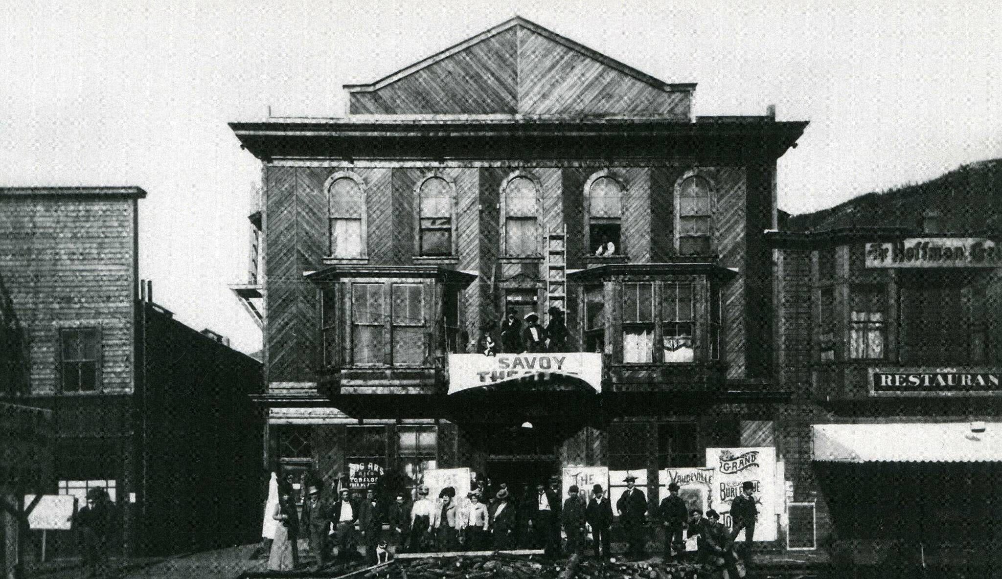 The Savoy Theatre troupe arrived in Dawson in August of 1900 and renamed the Palace Grand Theatre the Savoy. Note in this picture there are signs painted on glass, sign board and canvas. (Courtesy/Yukon Archives)