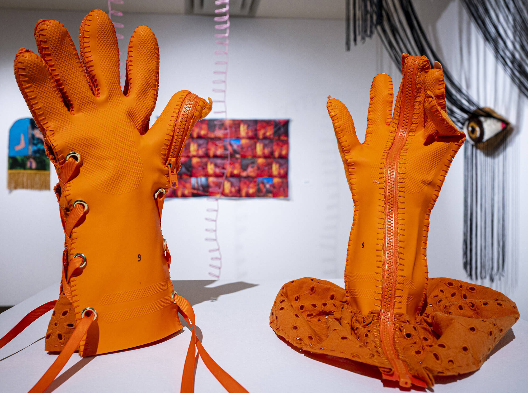 Orange Utility Gloves by Katie Newman is part of the Softcore exhibit by North Node Collective, featuring works by Courtney Holmes, Katie Newman, Heather Von Steinhagen and Manias. It is on display in the Yukon Energy Community Gallery at the Yukon Arts Centre until January 29. (Mike Thomas/Yukon Arts Centre)