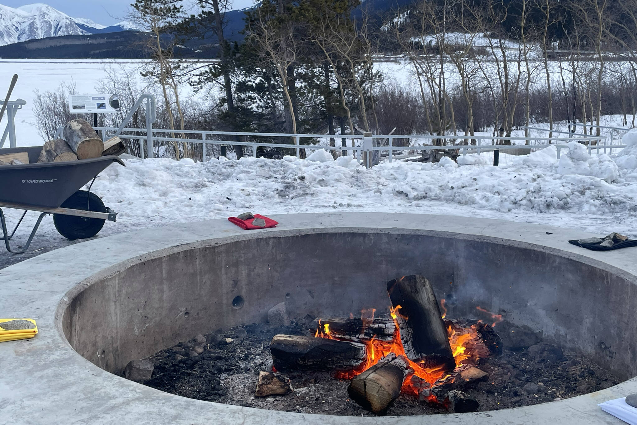 Sacred and ceremonial fire burning on shores of Nares Lake behind Haa Shagoon Hidi. The fire, healing and grieving is supported in Carcross by the other Daḵká nations, both the Taku River and Teslin Tlingits. (Lawrie Crawford/Yukon News)