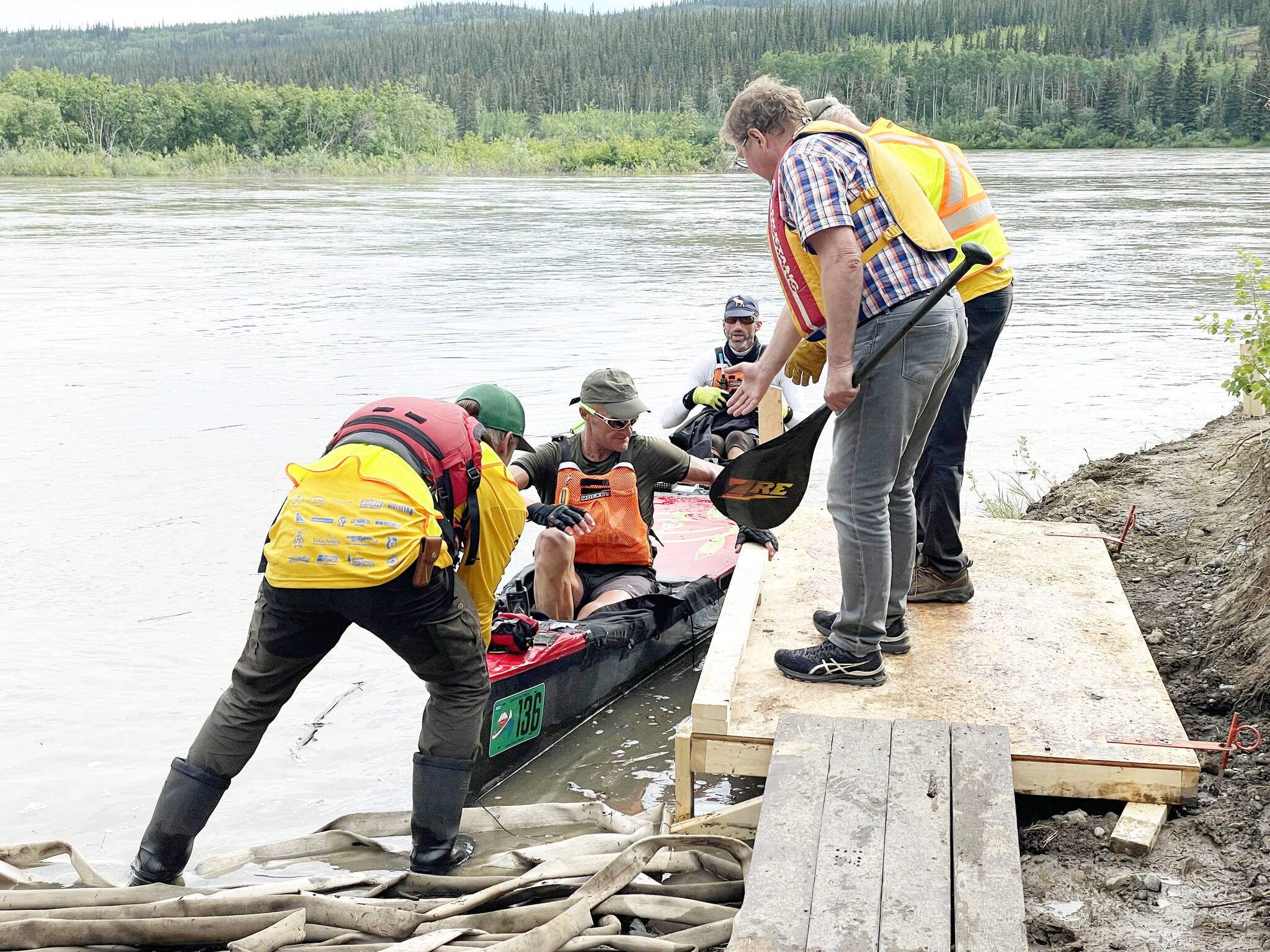Team Spirit of the Yukon, a mens tandem canoe team composed of Francis Soenen and Danny Veys, lands in Minto around 5:20 p.m. on June 23. The team was in 12th place as of early morning on June 24. (Lawrie Crawford/Yukon News)