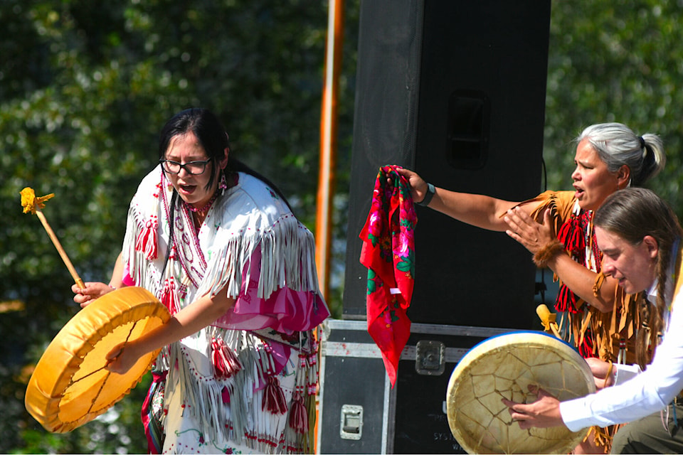 Allison Anderson leads the drumming for the Tr’ondëk Hwëch’in Hän Singers who performed on the Moosehide main stage for a crowd in the hundreds on Saturday, July 30. (Jim Elliot/Yukon News)