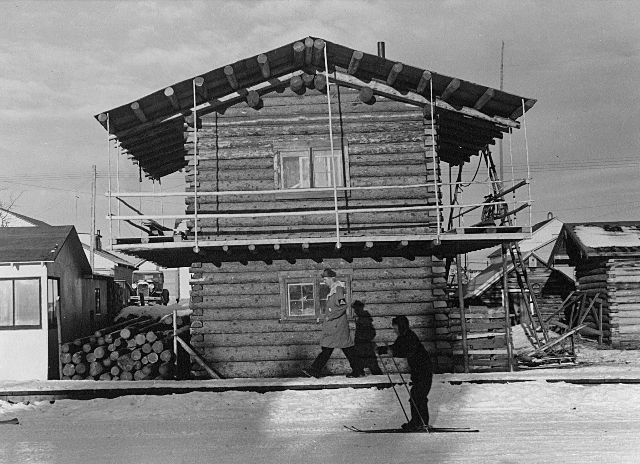 This two-storey log building on Lambert Street, photographed by Hubert Hollingworth during the Second World War, still stands today. The main floor window has since become a door. (Gates collection/Hubert Hollingworth photo)