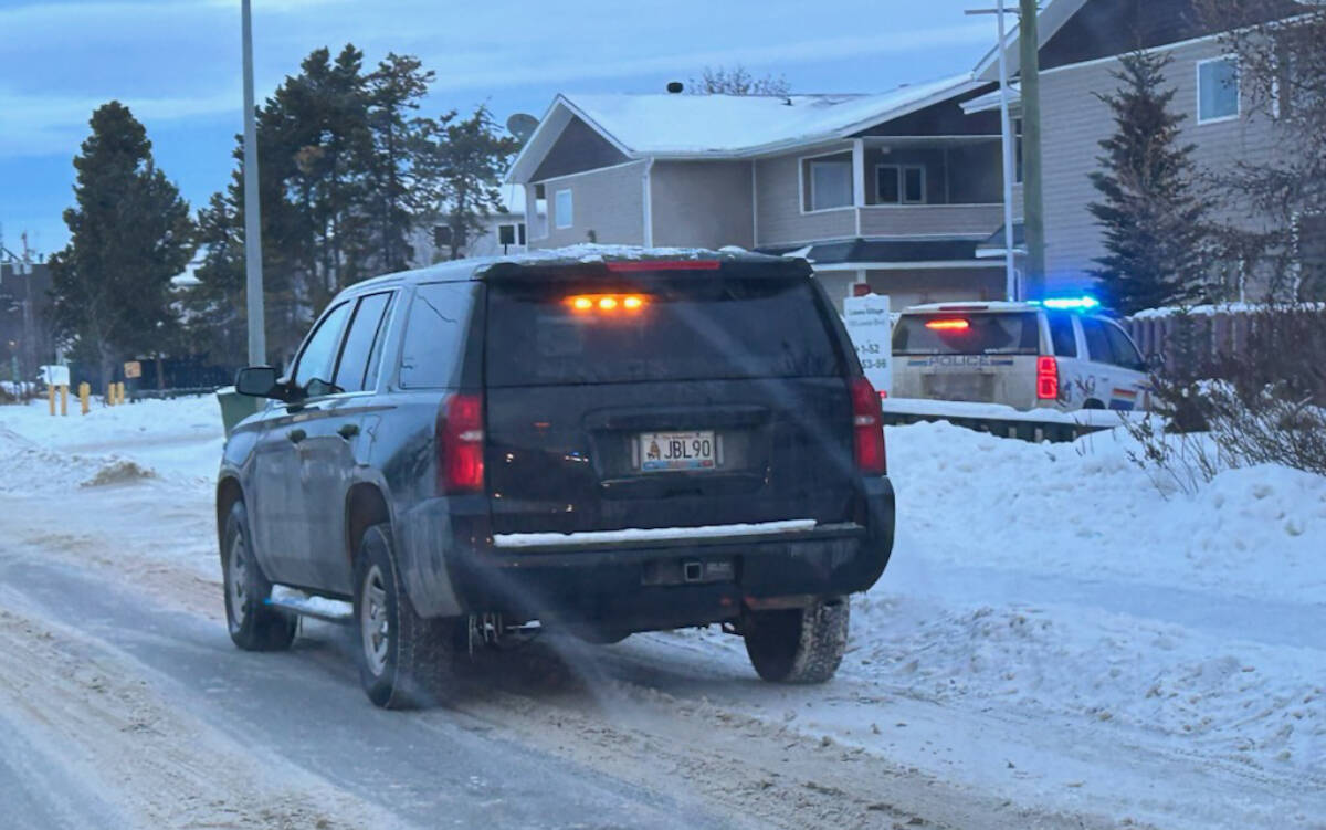 Police vehicles outside a home near the intersection of Lewes Boulevard and Duke Road in Whitehorses Riverdale neighbourhood on Jan. 20. (Submitted)