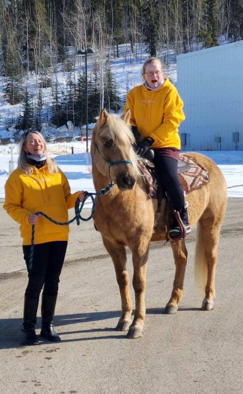 Diane Quilty rides a horse with sister Barbara by her side. (Courtesy/Rita Smith)