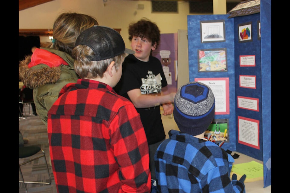Grade 7 Del Van Gorder School student Benjamin McFadyen of Faro explains his project about energy to visitors at the annual Yukon Stikine Regional Science Fair/STEM Expo held April 6 at the Mount McIntyre Recreation Centre. (Stephanie Waddell/Yukon News)