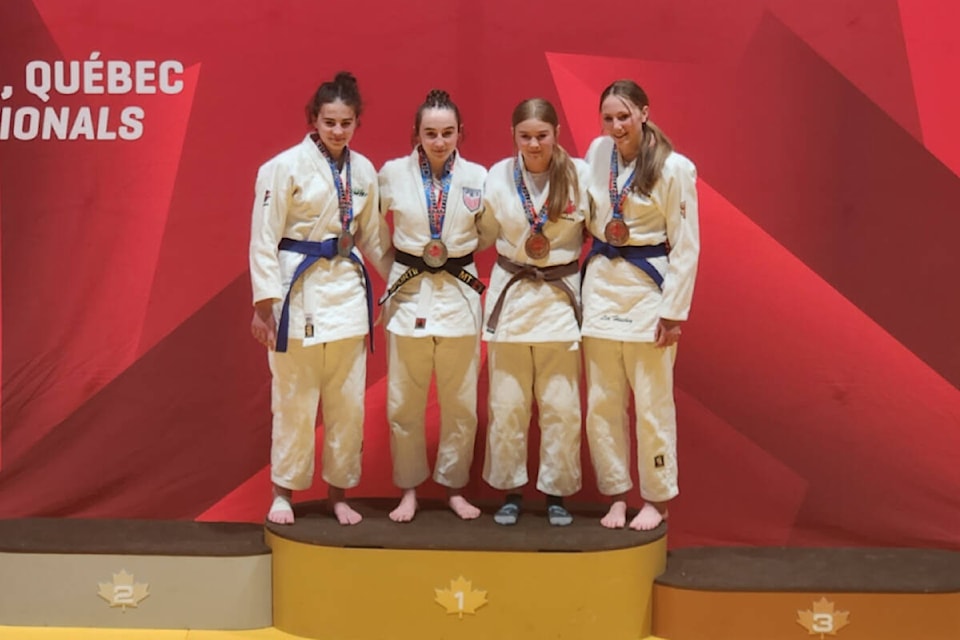 Lia Hinchey (far right) on the podium alongside the top athletes in the U16-57kg division at the 2023 Open Championships in Montreal. (Courtesy/Judo Yukon)