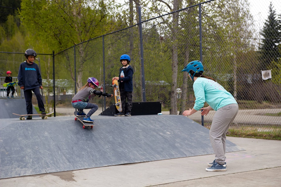 Ashley Swinton (right) teaches a group of kids at the skate park in Dawson City. She has been teaching skateboarding workshops throughout the Yukon for the last four years. (Courtesy/Ashley Swinton)