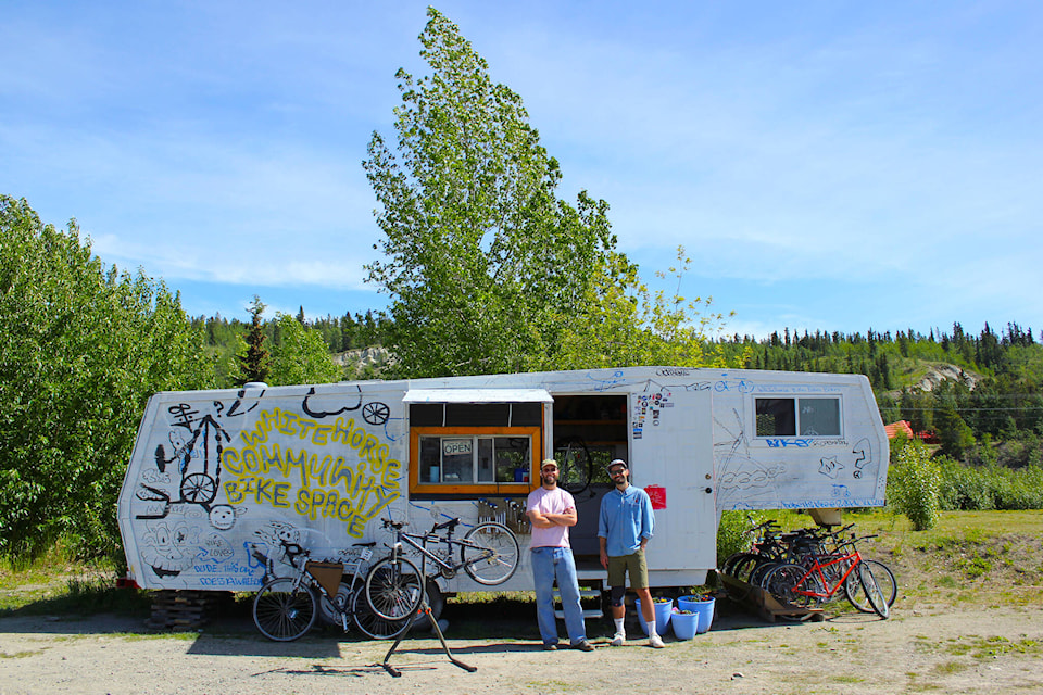 Kai Bruce (left) and Jesse Weymen (right) stand outside of Chainwhip, a new community bike space in Whitehorse. (Dylan MacNeil/Yukon News)