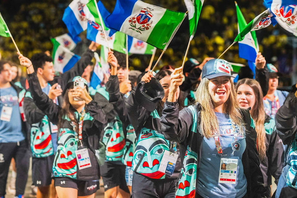 Team Yukon parades into the opening ceremonies of the North American Indigenous Games. (Caet Moir/Yukon News)