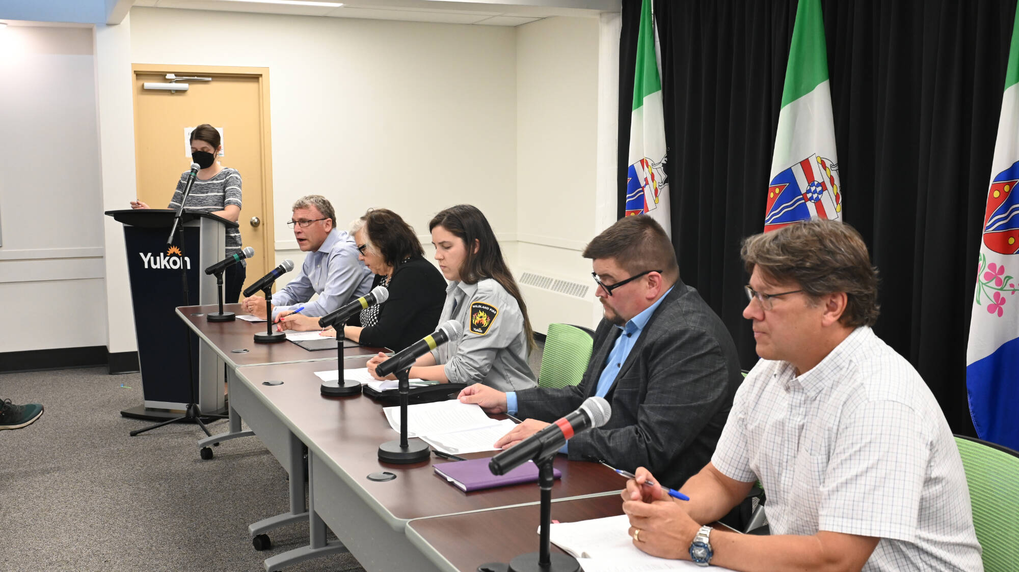 Yukon government ministers and representatives of its Wildland Fire Management, emergency measures and emergency social services branches briefed reporters on firefighting efforts and the assistance being provided to evacuees on Aug. 7. (Jim Elliot/Yukon News)