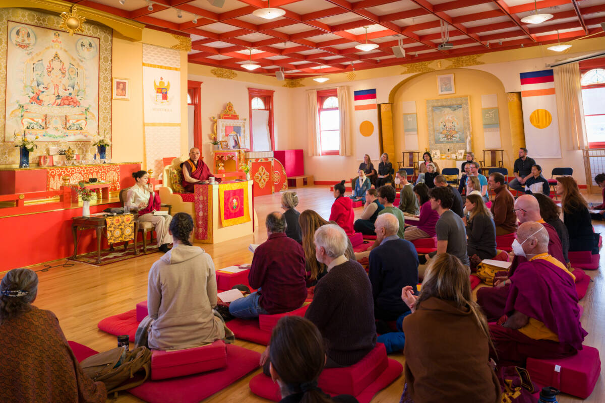 Khentrul Lodrö Thayé (right) speaks to students alongside his translator, Paloma Lopez Landry. (Eric Swanson Photography)