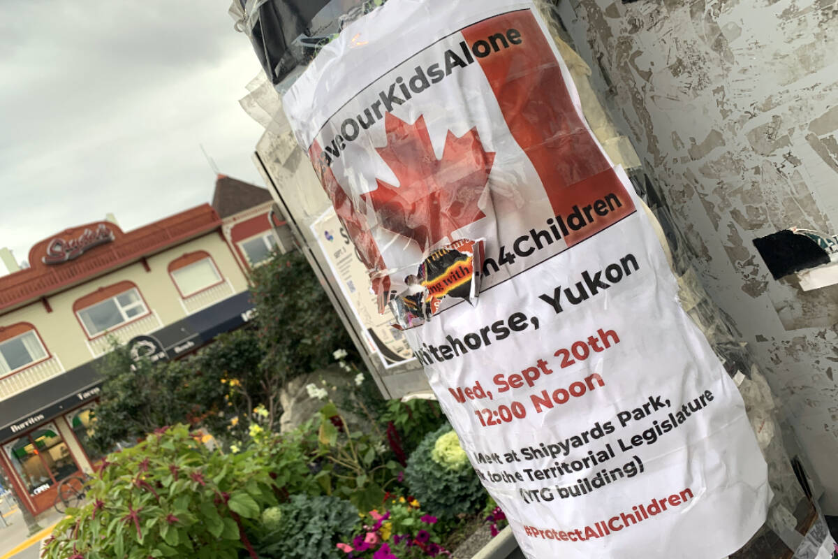 A poster for the Million March 4 Children, as seen at the intersection of Main Street and Second Avenue in Whitehorse on Aug. 31. (Dana Hatherly/Yukon News)