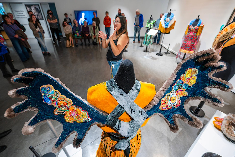 Kaylyn Baker gives a tour of artwork in the Yukon Prize 2023 exhibit. (Mike Thomas/Yukon Arts Centre)